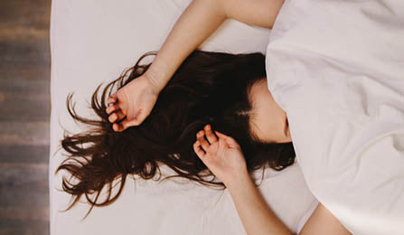 Women sleeping under a duvet